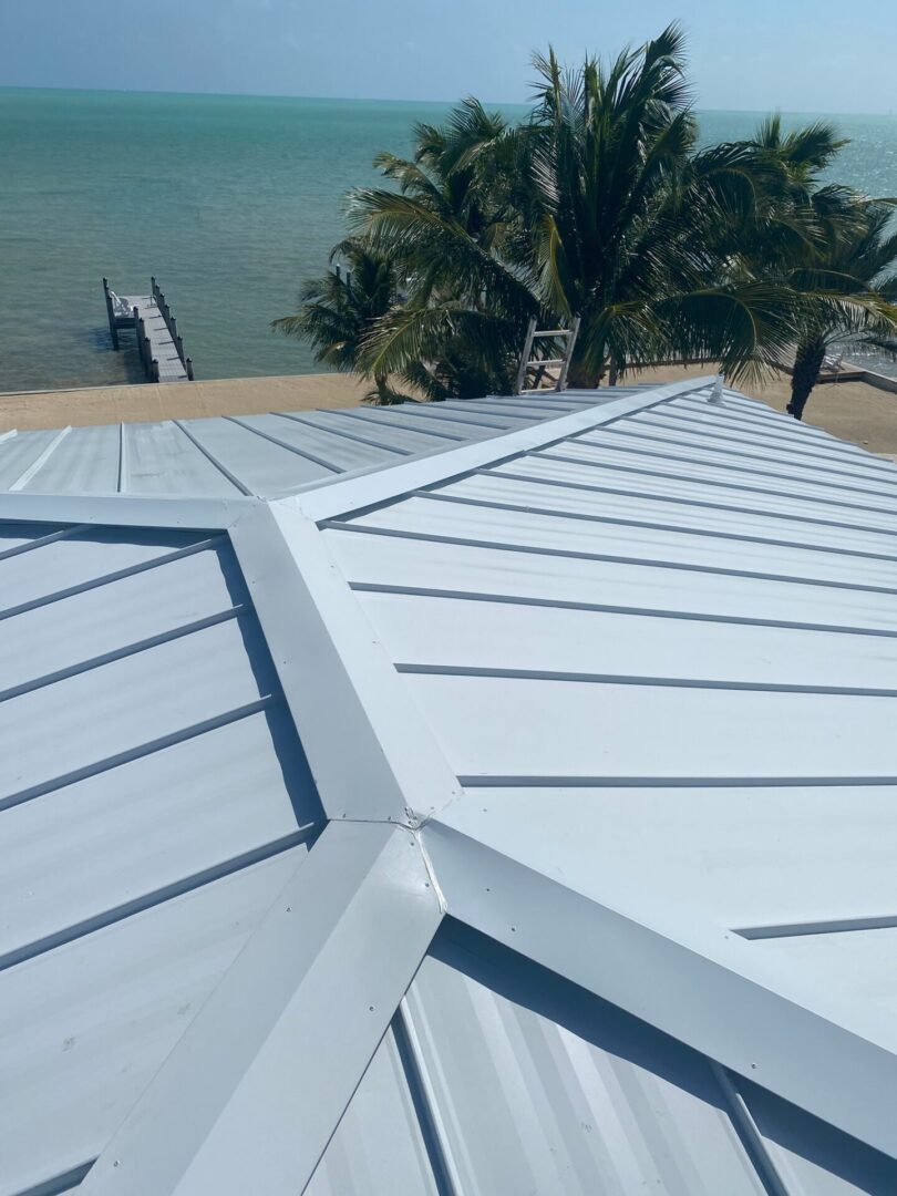 A white roof of an establishment near a beach