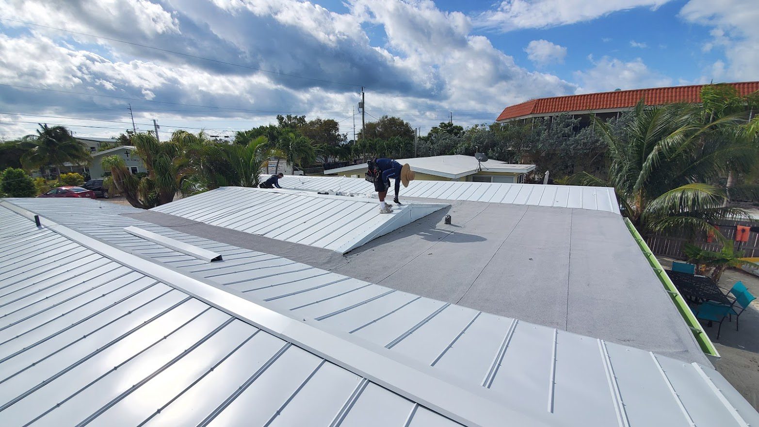 A man from Advanced Roofing South Inc. installing a roof