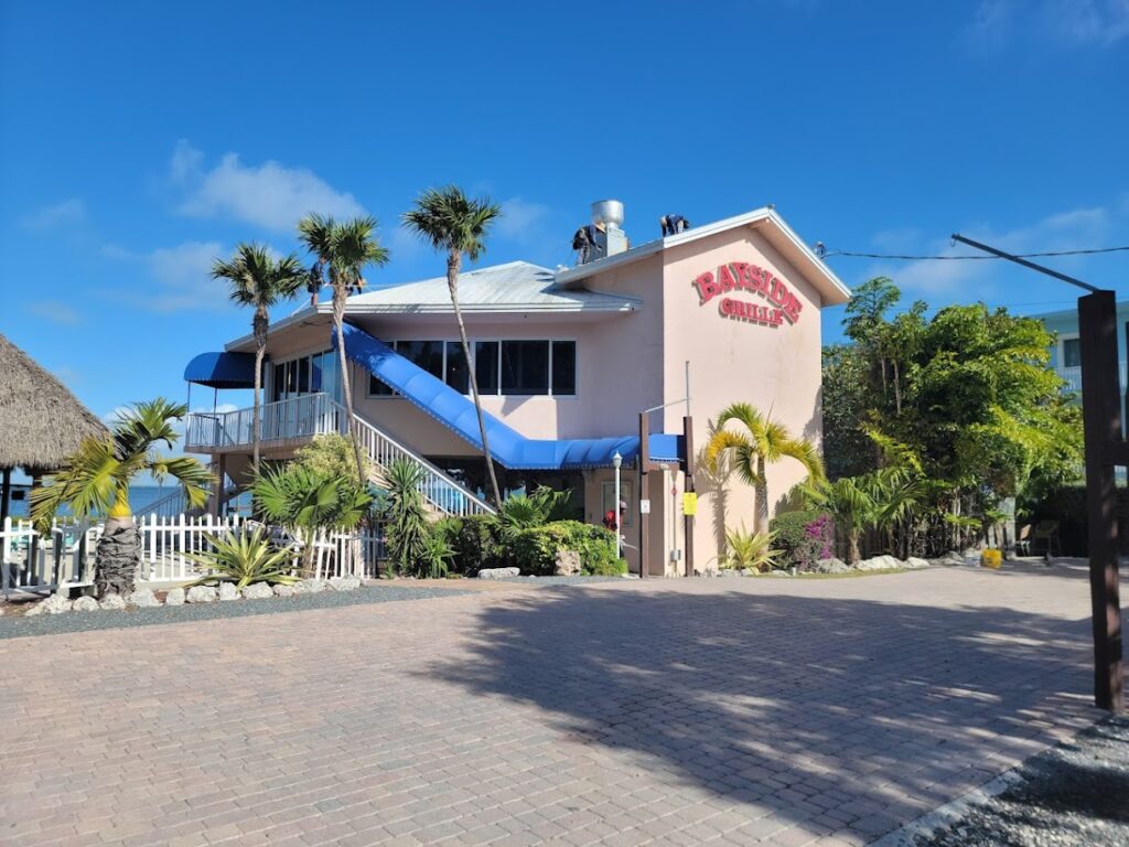 Commercial building with blue accents and palm trees